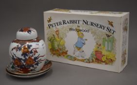 A boxed Wedgwood Peter Rabbit nursery set, two Oriental plates and a ginger jar.