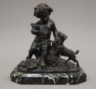 A bronze model of a putto and a goat, mounted on a marble plinth base. 20 cm high.