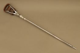 An aluminium shooting stick by Swaine & Adeney, owned by D Claridge 1929 of 76 South Audley Street,