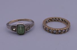 A 9 ct gold and silver green stone ring, and an eternity ring.