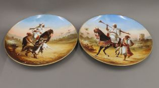 A pair of Montereau porcelain plates painted with Arabs. Each 37.5 cm diameter.