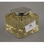 A silver top cut glass inkwell, hallmarked for Birmingham 1920. 6.5 cm high.