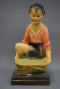 A large early 20th century advertising shop sculpture of a young girl.