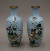 A pair of cloisonne vases. 24 cm high.