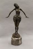 An Art Deco style bronze model of a girl on a marble base. 45.5 cm high.