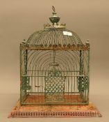 A Victorian tin birdcage. 47 cm high overall.