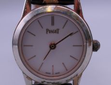 A Piaget 18 ct white gold cased ladies wristwatch. 2.5 cm wide. 12.9 grammes total weight.