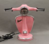 A pink Vespa lamp.