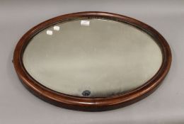 A Victorian mahogany framed mirror. 64 cm wide.