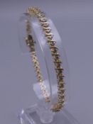 A 14 K gold bracelet set with approximately 2 carat of diamonds. 19 cm long. 7.