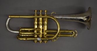 A rare H N WHITE 1946 Silvertone cornet in lacquered brass with a solid silver bell engraved H N