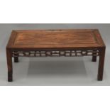 A Chinese carved hardwood low table. 86 cm long.