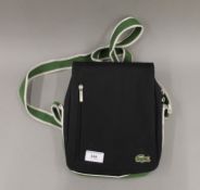 A Lacoste shoulder bag. 20 cm wide.
