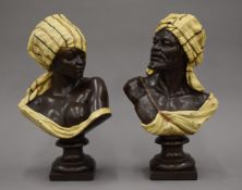 A pair of bronzed busts depicting North African figures. Each approximately 29 cm high.