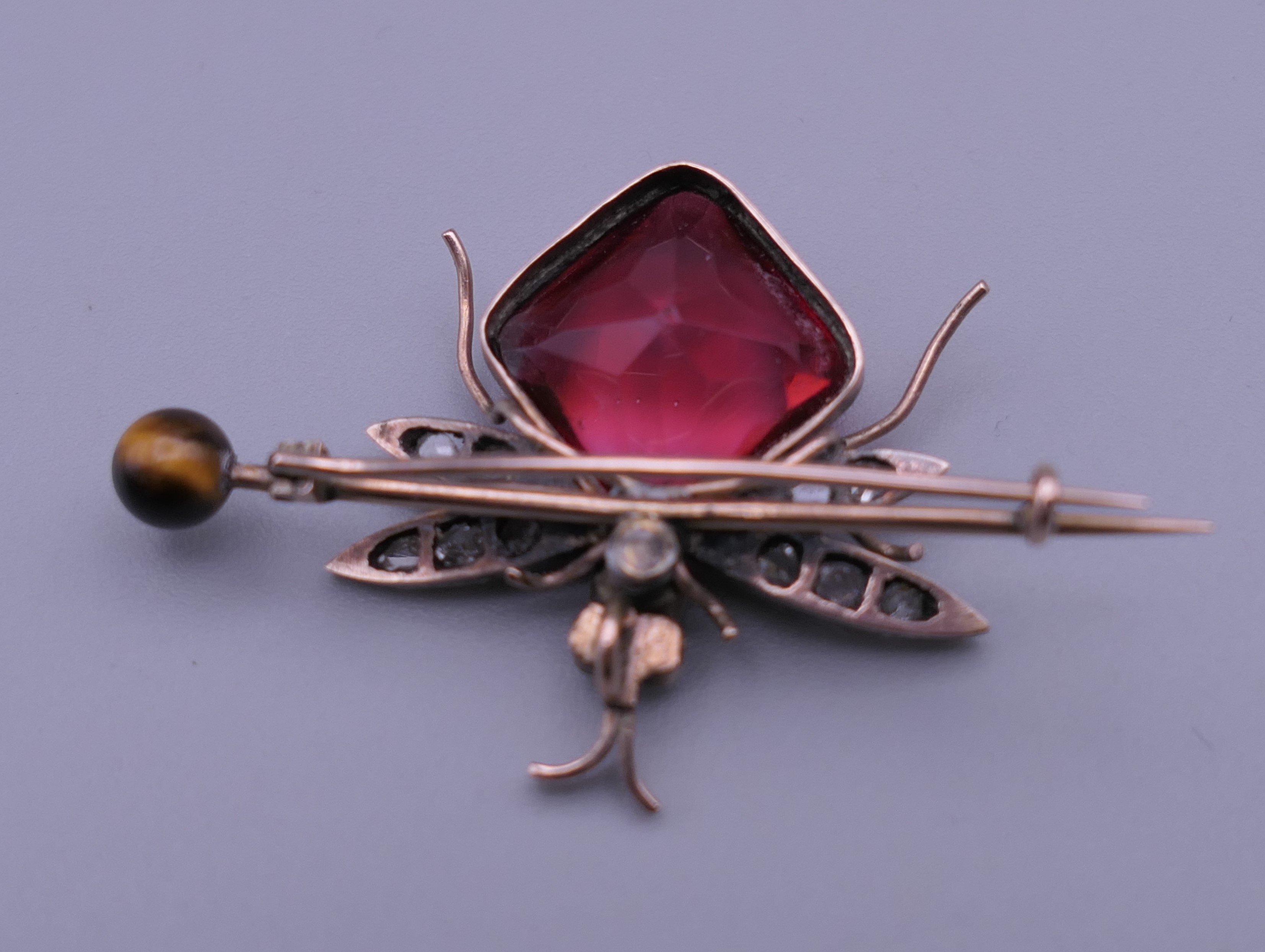 An unmarked gold diamond set bee brooch. 4 cm wide. - Image 4 of 7