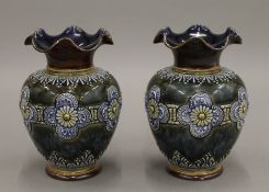 A pair of late 19th century Doulton Lambeth stoneware vases, incised L.W initials to base.