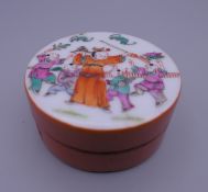 A small Chinese round porcelain box. 6.25 cm diameter.
