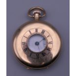 A 9 ct gold Waltham half hunter pocket watch. 5 cm diameter. 94 grammes total weight.