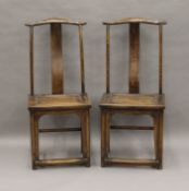 A pair of Chinese chairs.