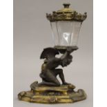 A 19th century bronze table lighter. 23.5 cm high.