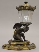 A 19th century bronze table lighter. 23.5 cm high.
