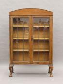 An early 20th century lead glazed oak bookcase. 89 cm wide.