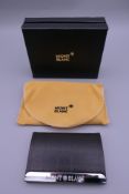 A business card holder stamped Mont Blanc, boxed.