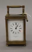 A brass cased carriage clock., the dial inscribed 'Noble and Chivers Bath'. 15 cm high.