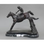 A bronze model of a horse and jockey. 30.5 cm high.