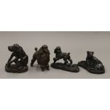 Four bronzed dog ornaments. The largest 11.5 cm high.