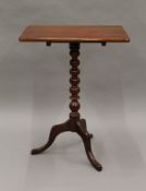 A Victorian mahogany tilt top tripod table. 51 x 34 cm.
