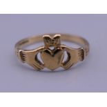A 9 ct gold claddagh ring. Ring size L. 1.2 grammes.