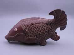 A Japanese wooden fish form box. 12 cm long.