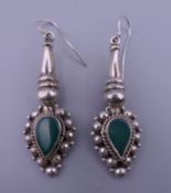 A pair of silver and jade drop earrings. 4.5 cm high.