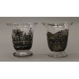Two glass vases decorated with hunting and coaching scenes. 16 cm high.