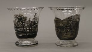 Two glass vases decorated with hunting and coaching scenes. 16 cm high.