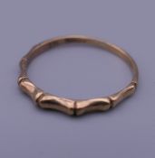 A 9 ct gold faux bamboo ring. Ring size O/P. 1.2 grammes.