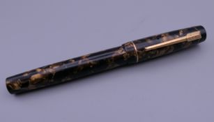 A Croxley fountain pen with 14 ct gold nib.