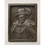 A small oak panel carved with a bust of a gentleman. 10.5 cm wide.