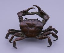 A bronze model of a crab. 11 cm wide.