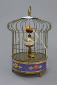 A birdcage clock. 19 cm high.