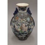 A late 19th/early 20th century Japanese Satsuma vase. 31 cm high.