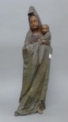 A bronze model of Guanyin and a child. 59 cm high.