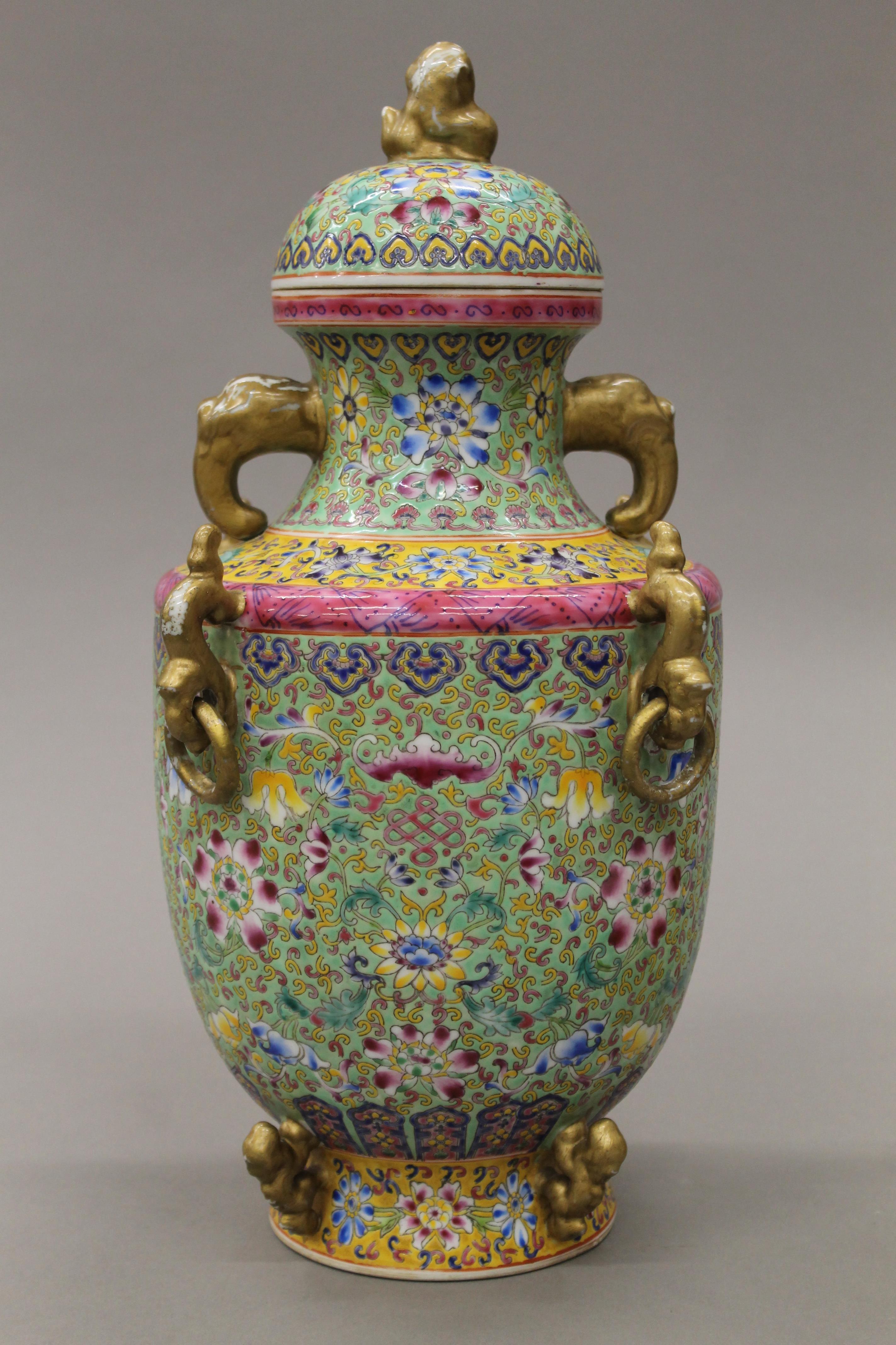 A Chinese porcelain turquoise and yellow ground lidded baluster vase. 41 cm high.