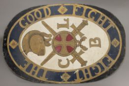 A double sided painted roundel, inscribed ''Fight The Good Fight''. 97.5 cm high.