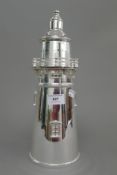 A silver plated lighthouse form cocktail shaker. 34.5 cm high.