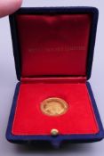 A 22 ct gold RAF Battle of Britain 25th Anniversary coin, boxed. 3.5 grammes.