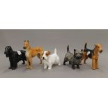 Five various Royal Doulton models of dogs. The largest 16 cm high.