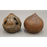 A carved gourd and a carved Brazil nut.