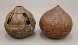 A carved gourd and a carved Brazil nut.